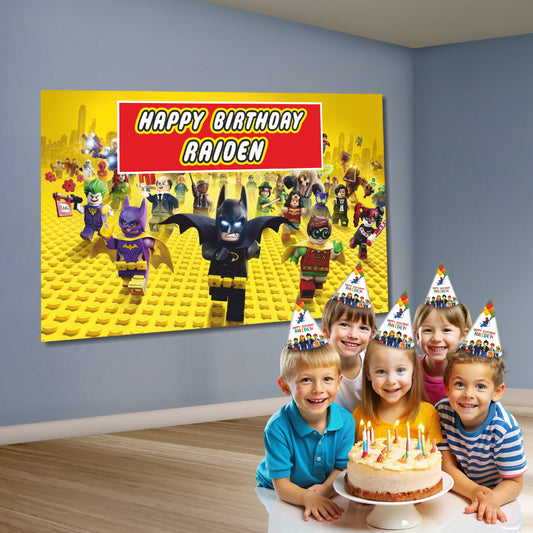 Close-up of BluParty Lego DC super heroes backdrop design showing Batman and Superman in Lego minifigure brick art style with vibrant superhero colour palette