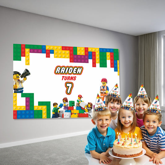 LEGO themed birthday party decoration setup showing personalized flex backdrop banner with vibrant brick graphics behind a cake table