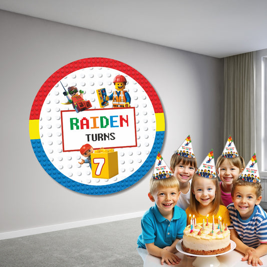 LEGO theme customized circular birthday backdrop displayed behind a cake table with personalized name and birthday number in bold brick design surrounded by red yellow blue balloon garland kids party India