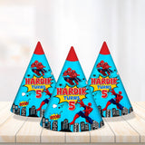 Blue cone hats with a skyline and yellow birthday name for a Spider-Man birthday party