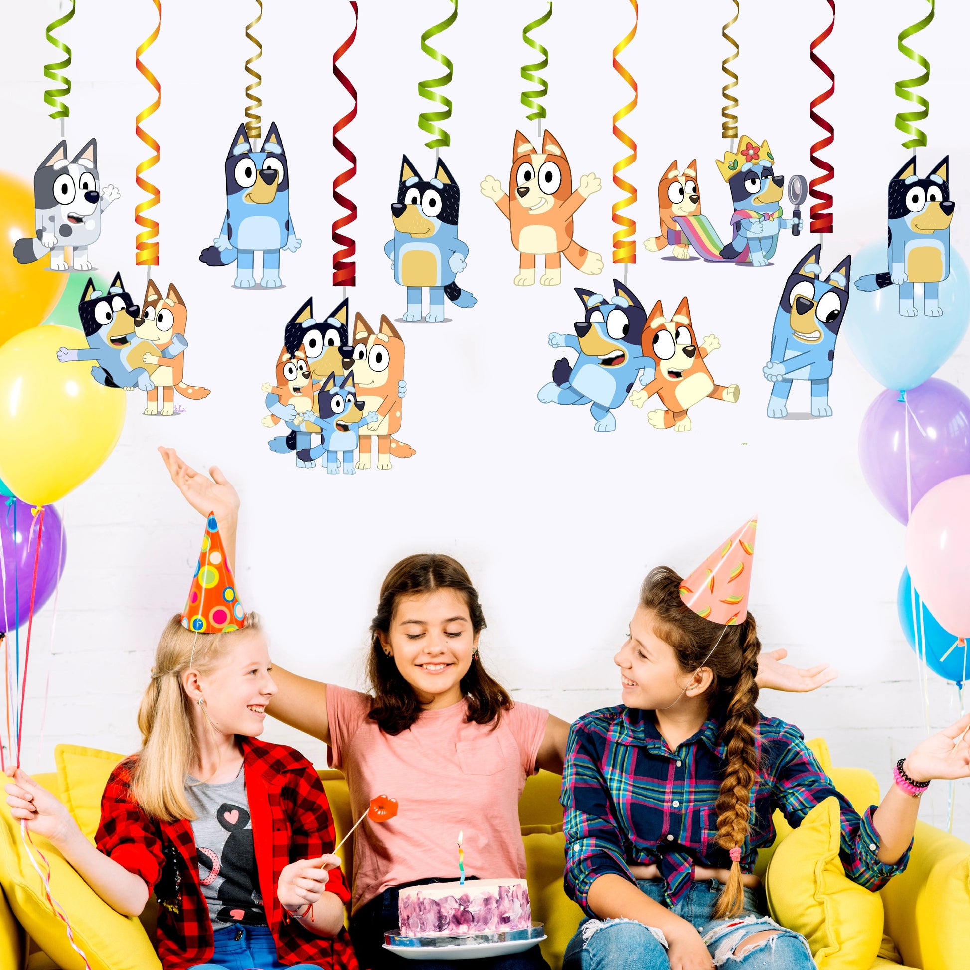 Bluey and Bingo themed hanging swirl ceiling decorations displayed above a kids birthday party table setup, vibrant spiral birthday party decoration – BluParty India