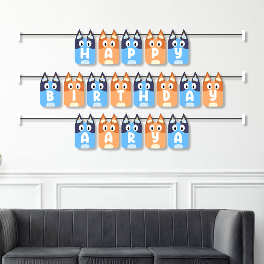 Bluey family themed personalised name bunting displayed as birthday party wall decoration above a cake table, full Heeler family character design – BluParty India