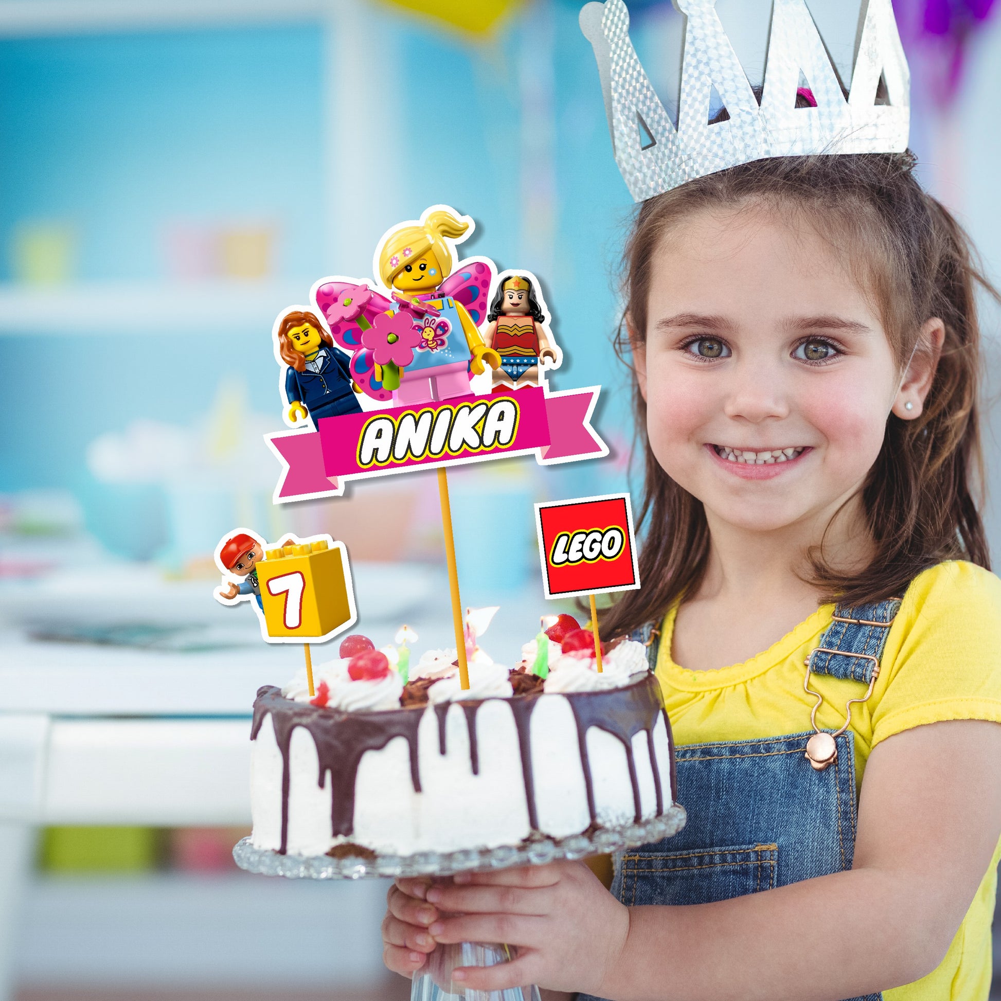 Classic Lego brick style Happy Birthday cake topper inserted on a decorated birthday cake for a themed kids party in India
