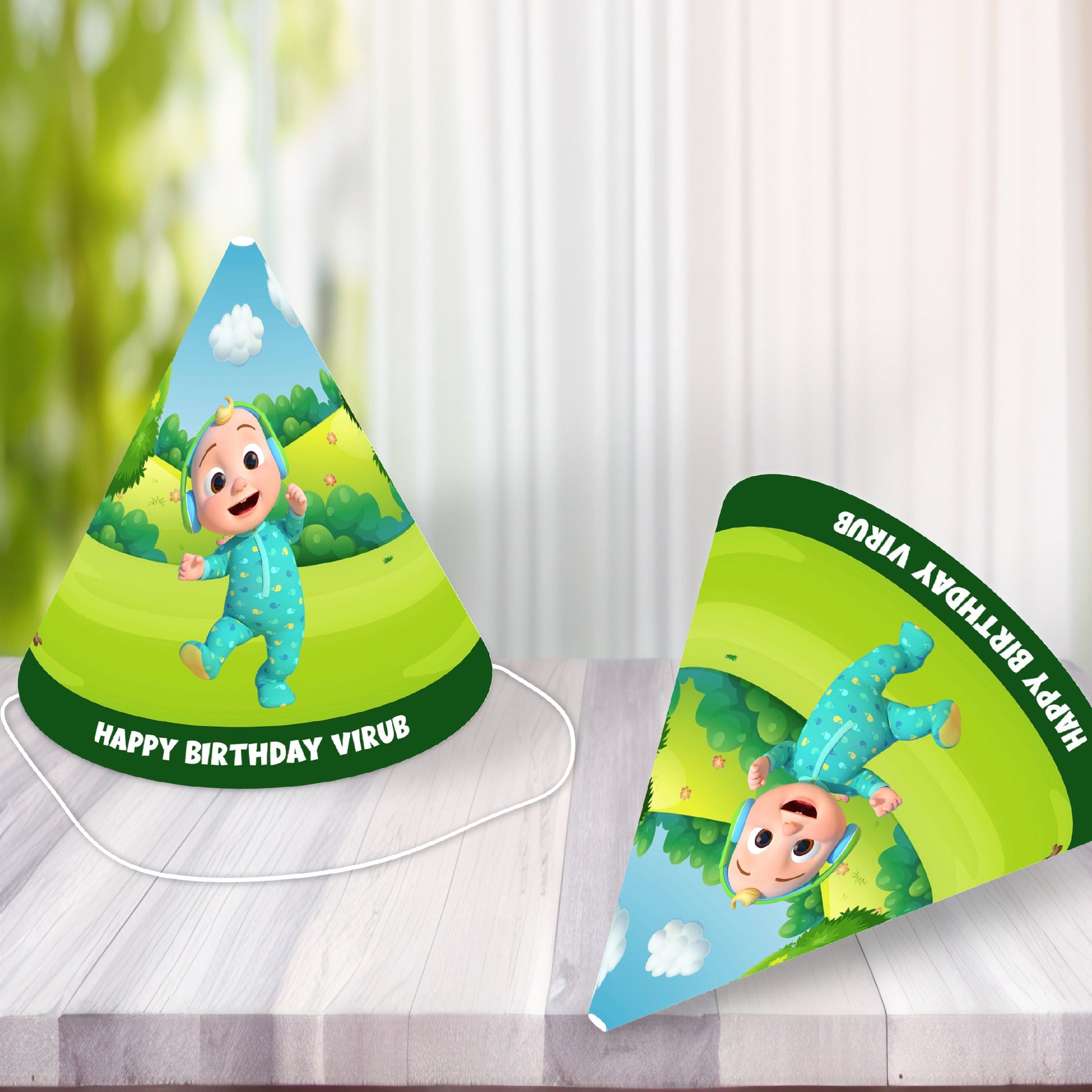 Kids wearing personalised Cocomelon JJ birthday party cone hats at a Cocomelon themed birthday party, showing adjustable fit and JJ character print – BluParty India