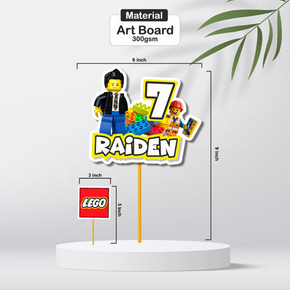 Close-up of a colourful Lego brick customized cake topper showing printed name, event time, venue, and RSVP contact on premium 300GSM artboard