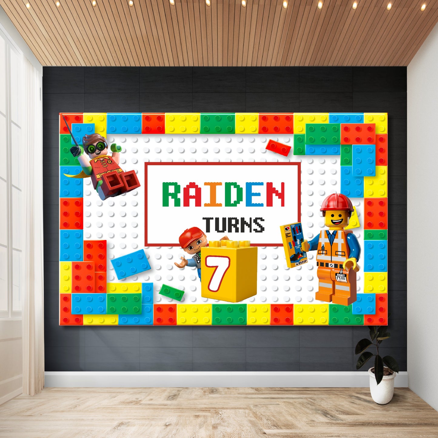 Lego theme personalized birthday backdrop installed at kids party showing child's name and age as design centrepiece in bold Lego brick typography with vibrant red yellow blue green colours by BluParty India