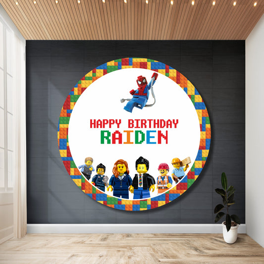 Personalized LEGO theme round birthday backdrop with child's name and age printed in vibrant LEGO brick design on circular flex material for kids birthday party decoration in India

