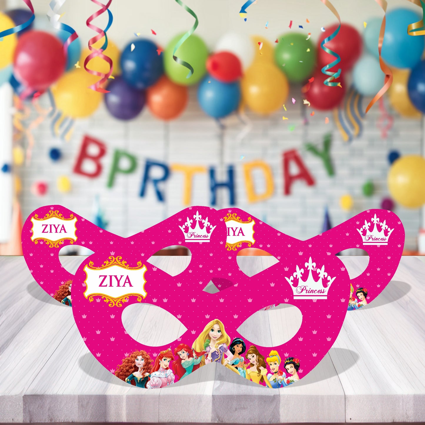 Princess theme personalized birthday eye masks with royal masquerade design and child's name displayed at a girls birthday party celebration with pink gold balloon decoration India